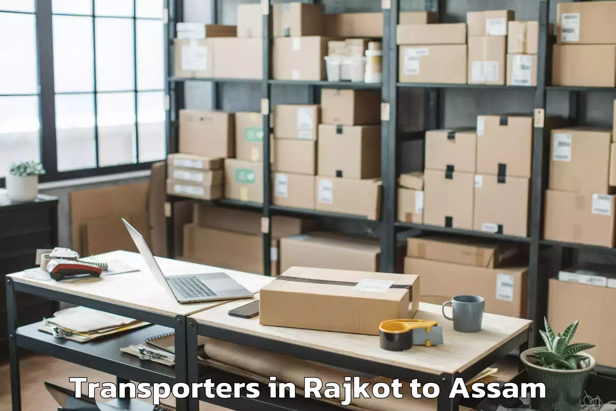 Top Rajkot to Dudhnoi Transporters Available